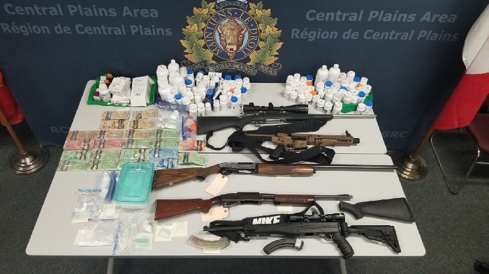 Firearms, pellet gun, ammunition, Canadian currency, cannabis, cocaine, methamphetamine and other substances that were seized by the police.